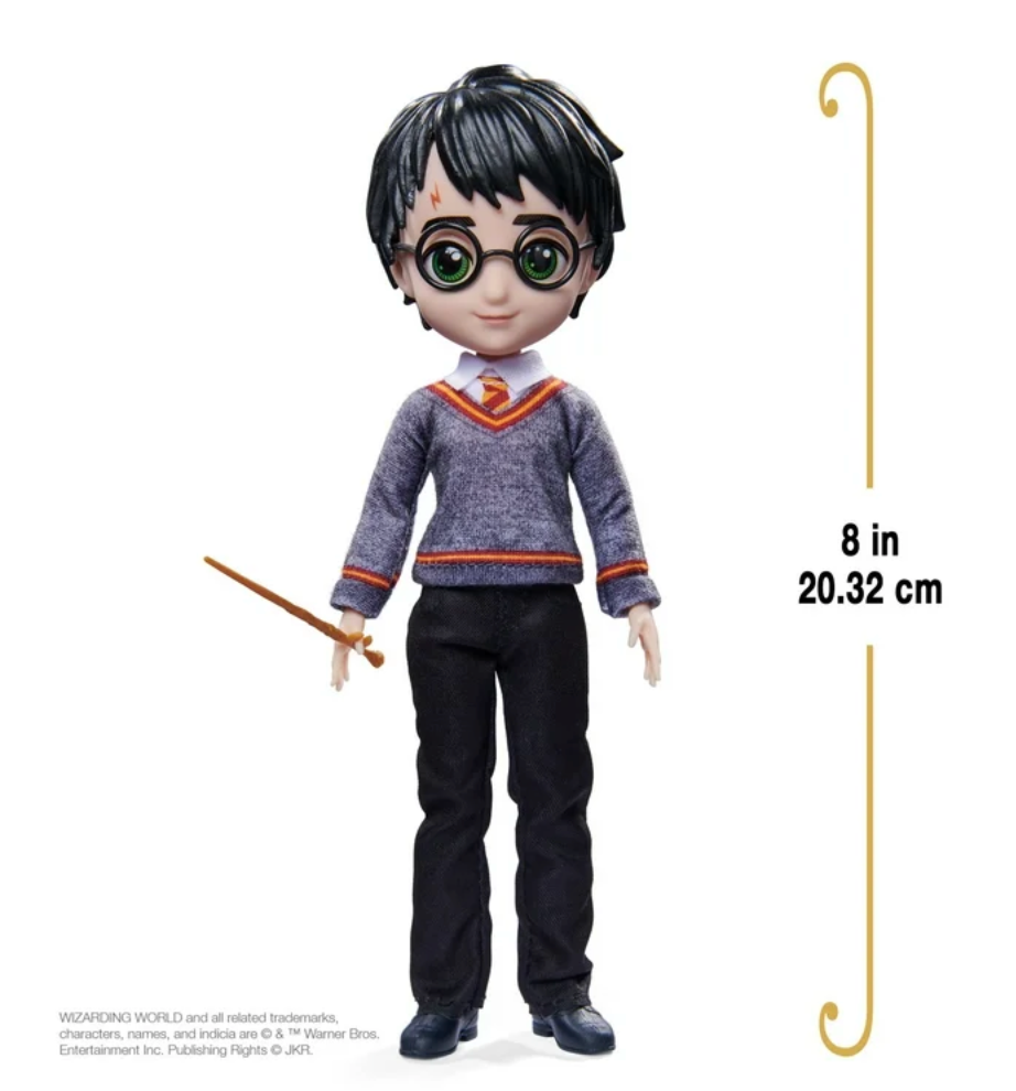 A Harry Potter doll from the Wizarding World collection, dressed in a Hogwarts uniform with a wand in hand. Perfect for collectors and fans of the series.