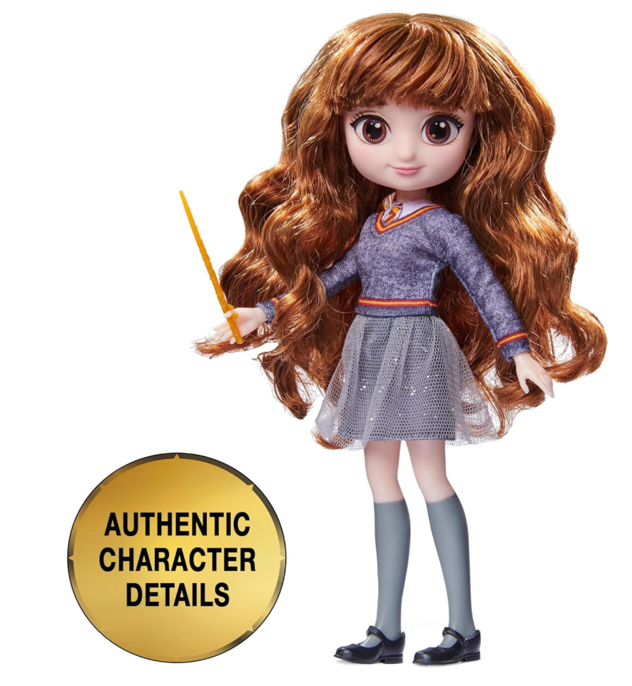 A Hermione Granger doll from the Wizarding World collection, dressed in a Hogwarts uniform and holding a wand, perfect for fans and collectors.