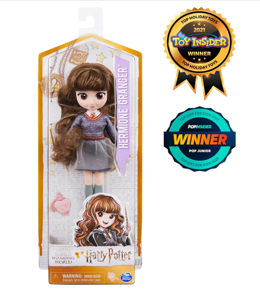 A Hermione Granger doll from the Wizarding World collection, dressed in a Hogwarts uniform and holding a wand, perfect for fans and collectors.