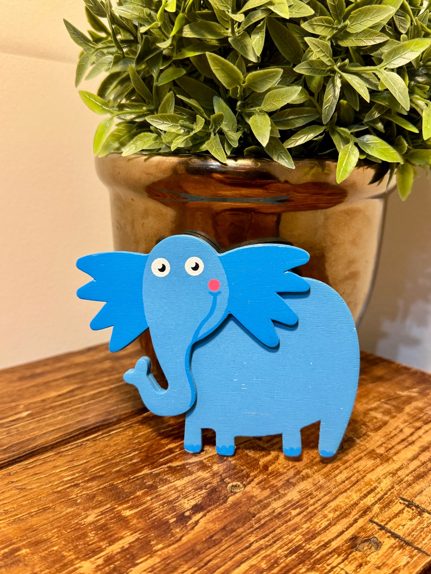 A wooden cutout of Horton the Elephant, approximately 4 inches by 4 inches, inspired by Horton Hears a Who! Featuring smooth edges and a detailed silhouette, perfect for book lovers, teachers, and children's room decor.