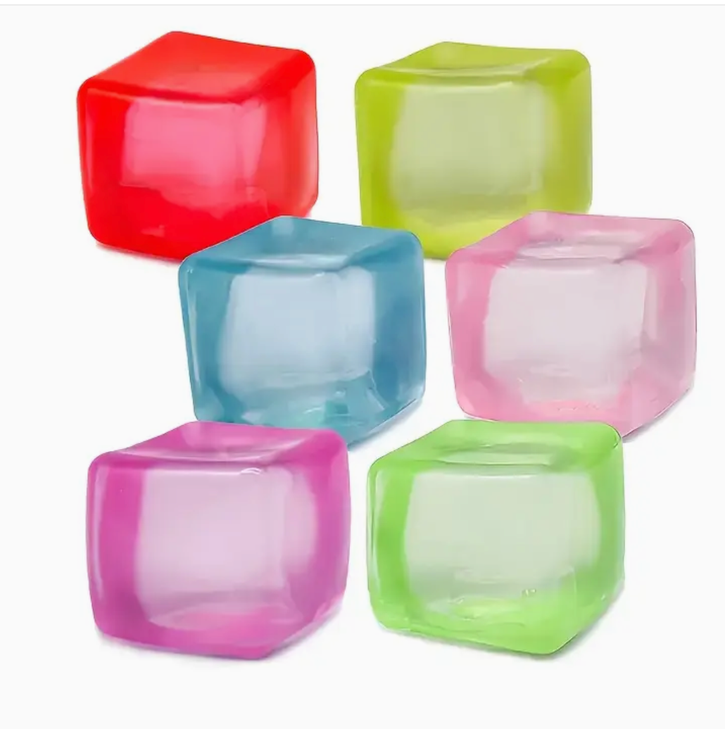 Colorful cube-shaped ice molds on a white background