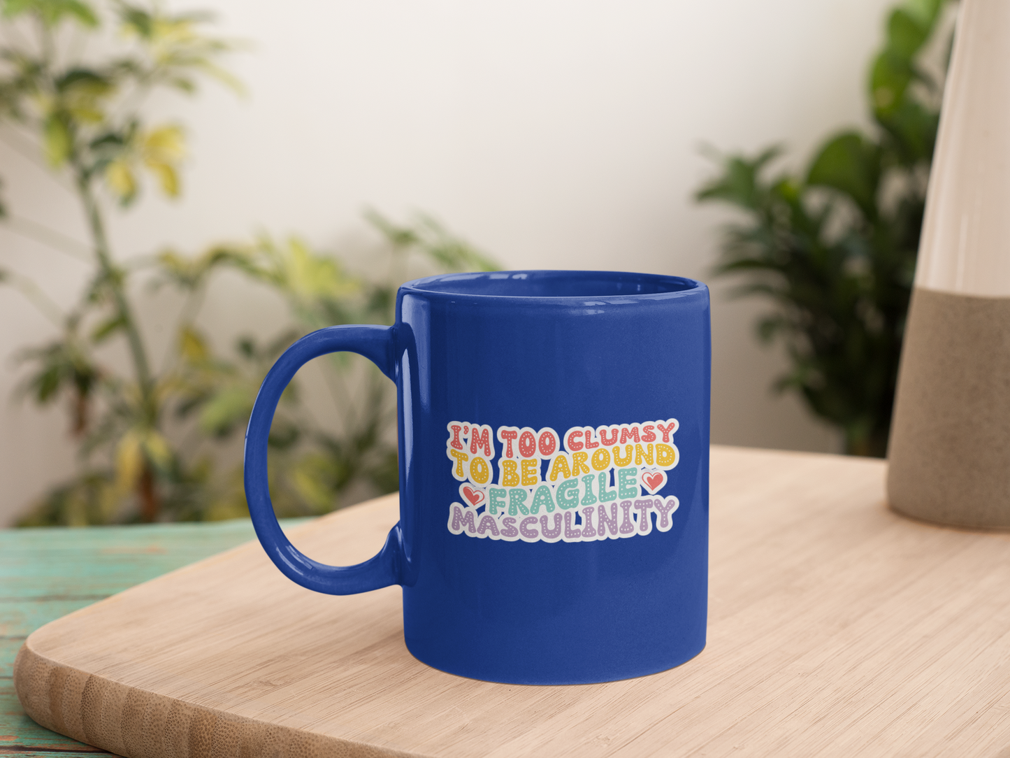 A UV-DTF sticker featuring the phrase I'm Too Clumsy to Be Around Fragile Masculinity in bold, witty typography. Perfect for decorating water bottles, laptops, Kindles, mugs, car windows, and more.