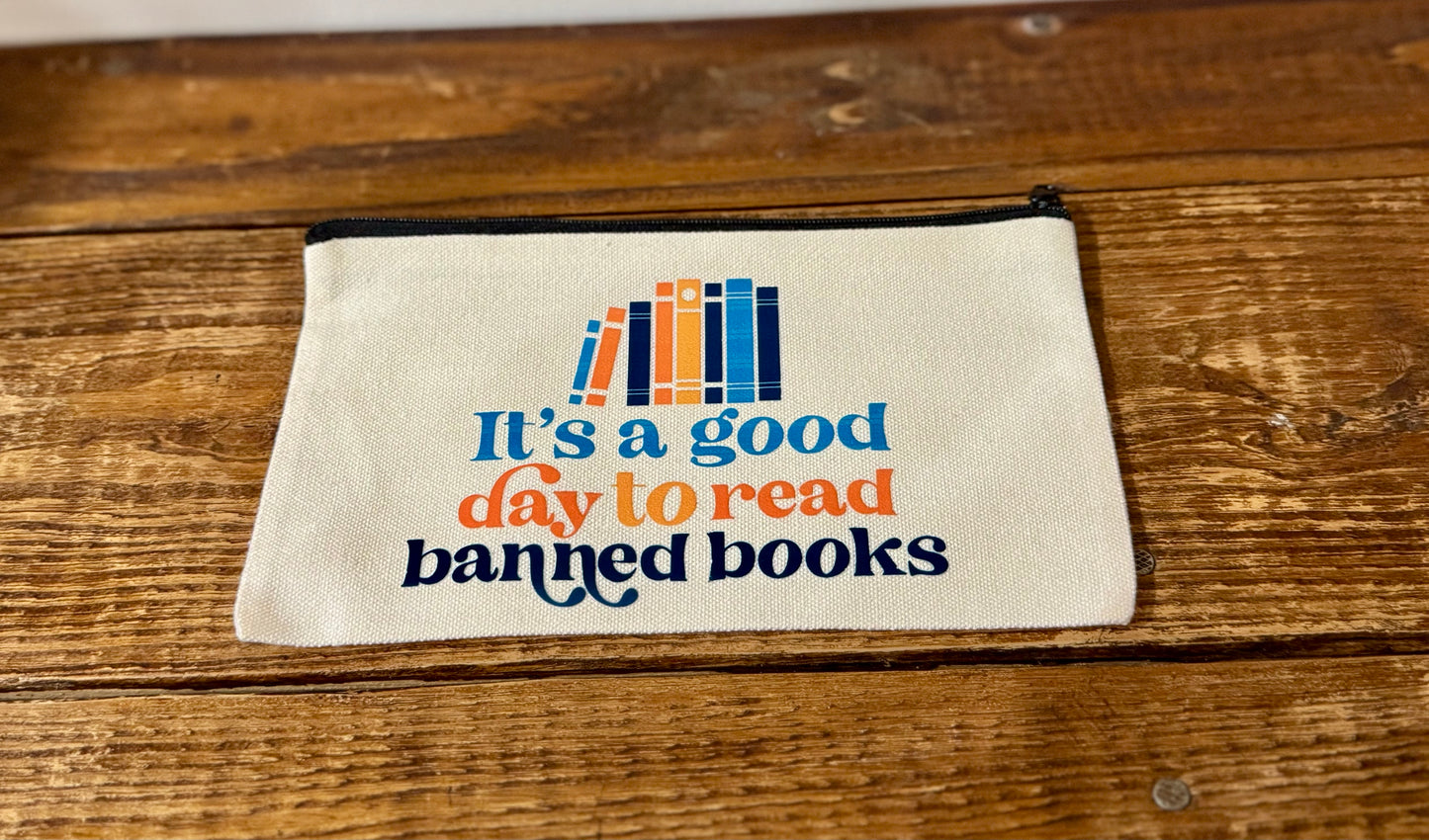 A stylish accessories bag featuring the phrase It's a Good Day to Read Banned Books in bold lettering. Perfect for book lovers, readers, and advocates of intellectual freedom.