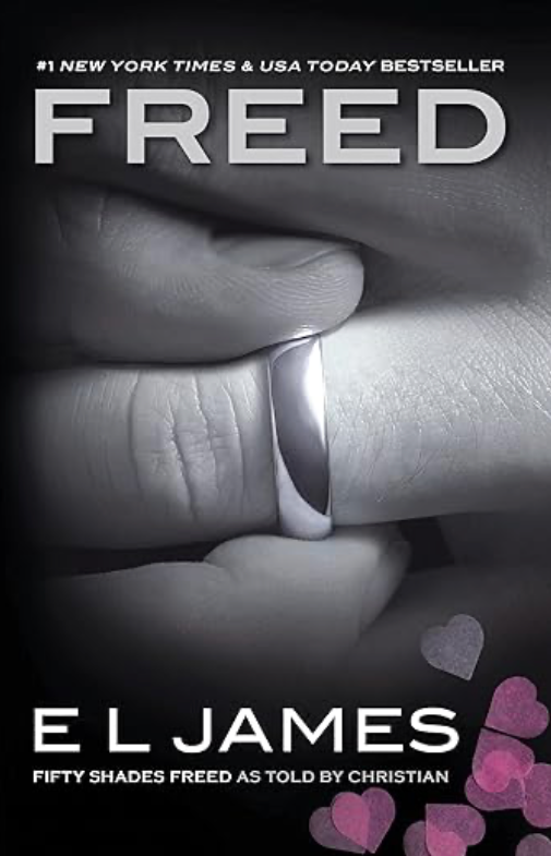 Cover of Fifty Shades Freed by E.L. James, featuring a pair of silver handcuffs against a dark background, symbolizing passion, commitment, and the struggle for freedom within love.