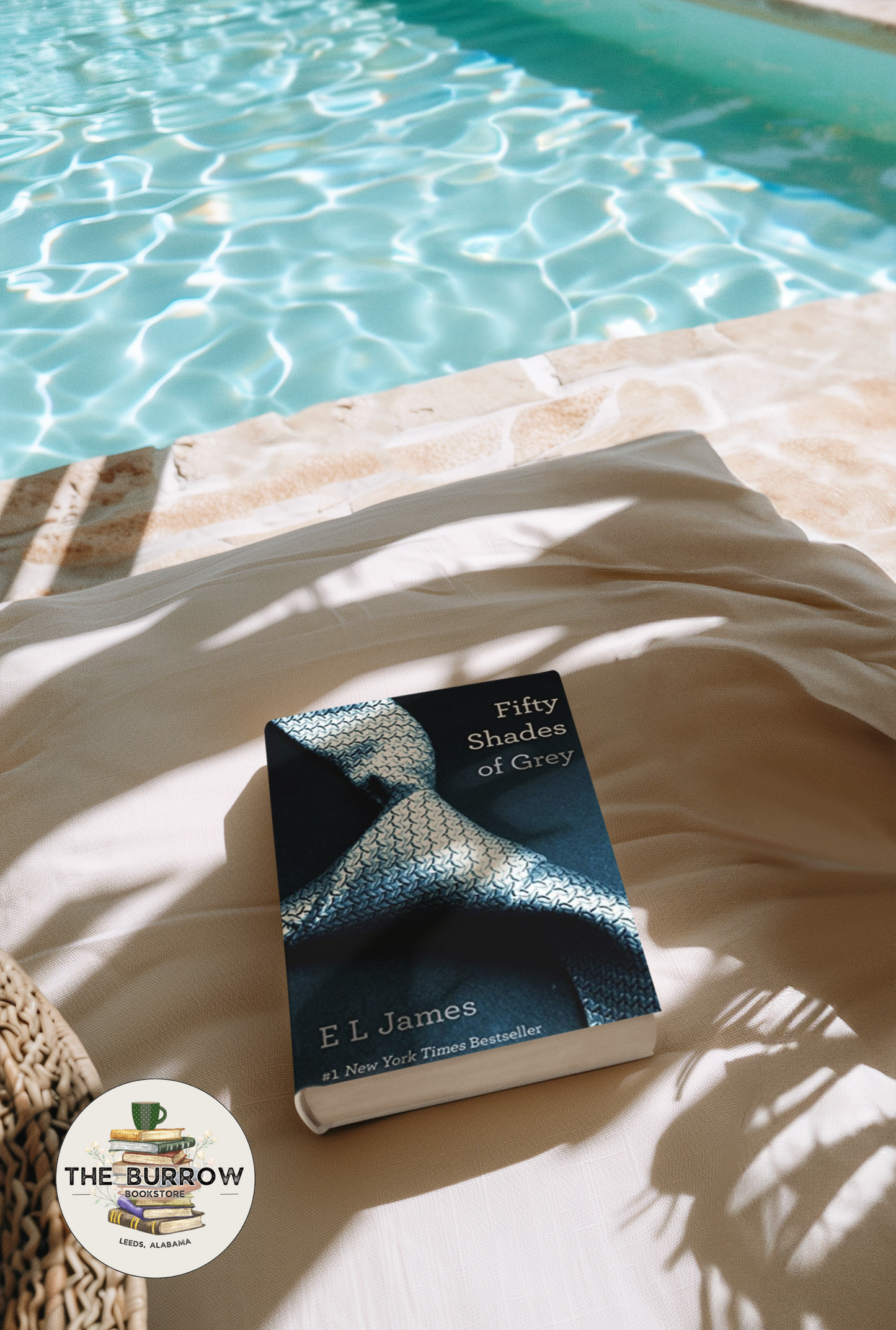Cover of Fifty Shades of Grey by E.L. James, featuring a close-up of a silver-grey necktie against a dark background, symbolizing control, power, and seduction in this contemporary romance novel.
