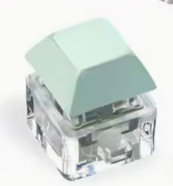 pastel green colored keyboard fidget toy keychains with clicky mechanical keyboard style buttons