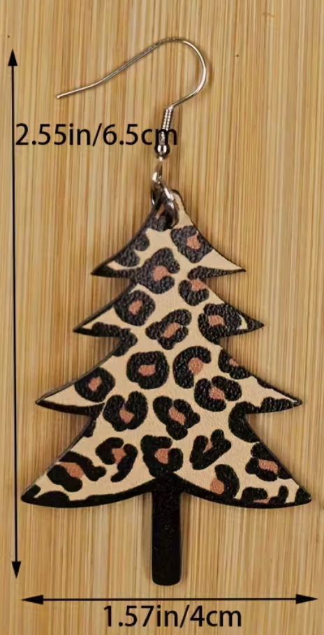 Leopard print Christmas tree earrings with measurements on a wooden background