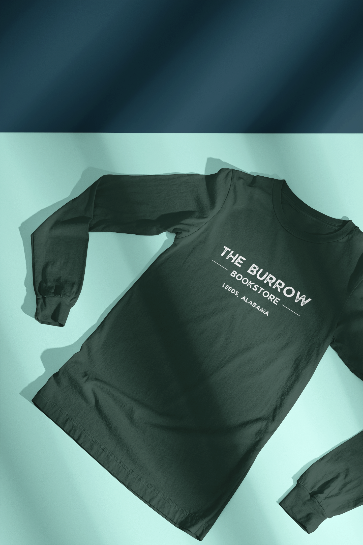Long-sleeve t-shirt with The Burrow Bookstore, Leeds AL logo, ideal for book lovers and small-town supporters.