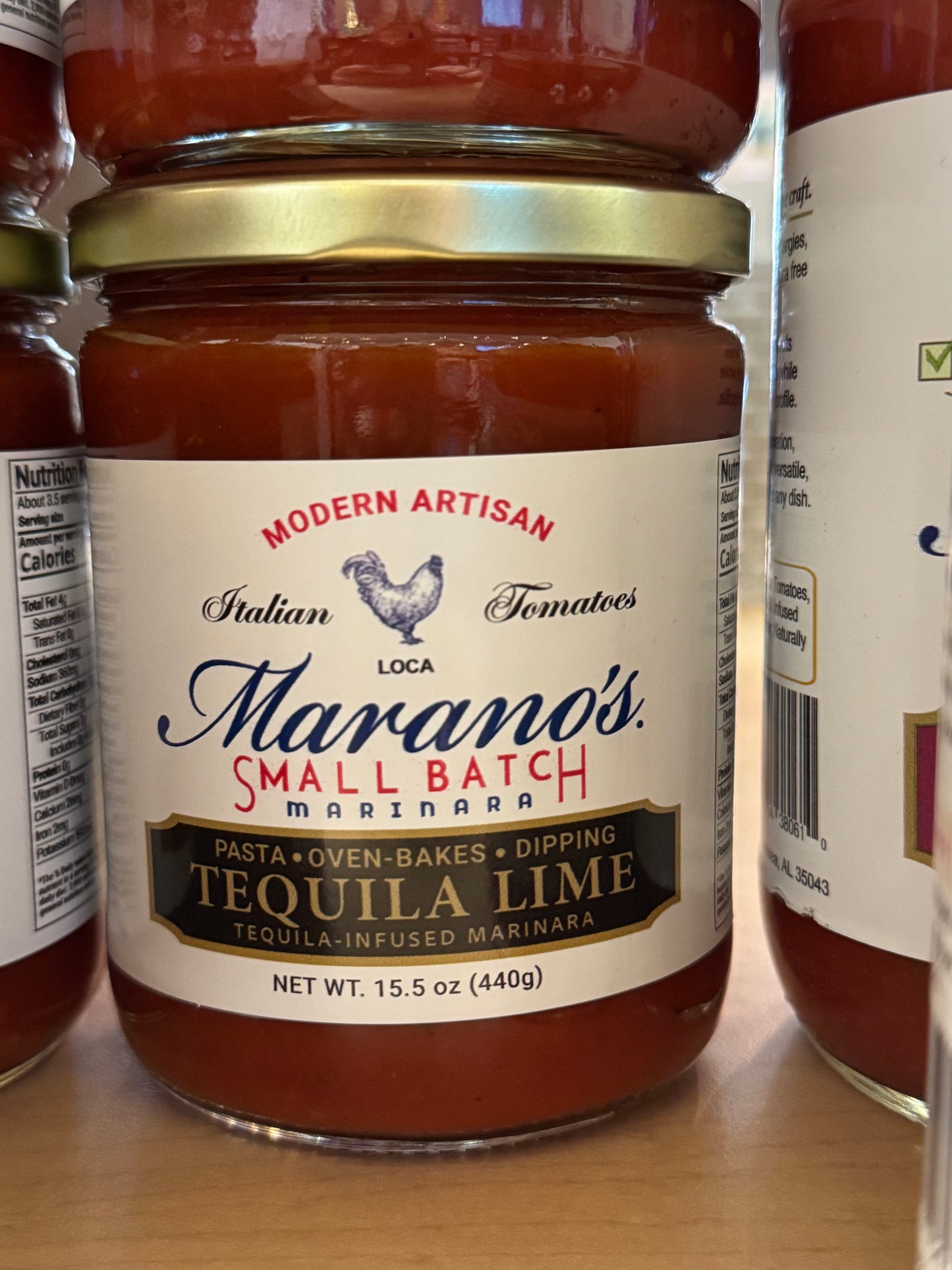 Jar of Marano's Small Batch Tequila Lime Marinara sauce on a wooden surface