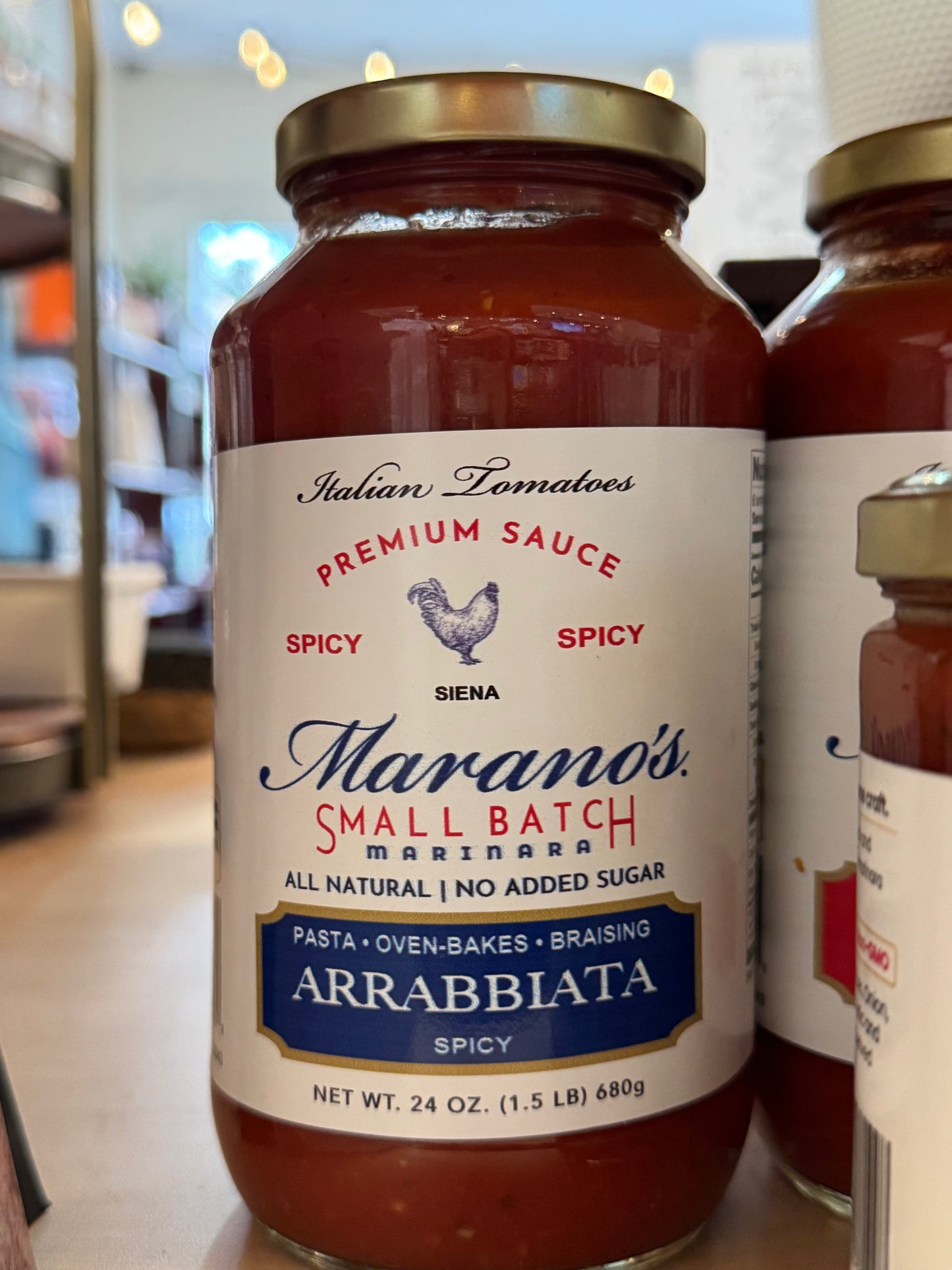 Jar of Marano's Small Batch Arrabbiata spicy pasta sauce on a store shelf.