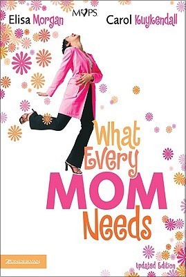 Book cover of 'What Every Mom Needs' with a woman in a pink coat and floral background