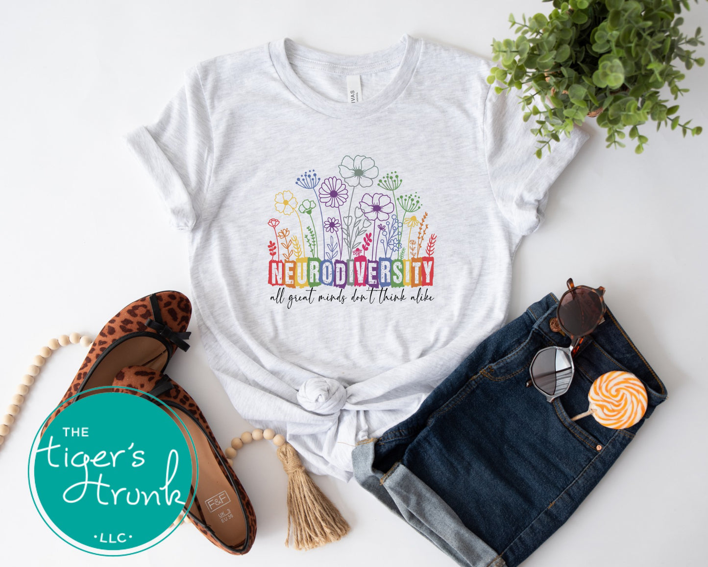 T-shirt with floral elements and the quote "All Great Minds Don’t Think Alike," gift-ready design for neurodivergent pride and mental health support