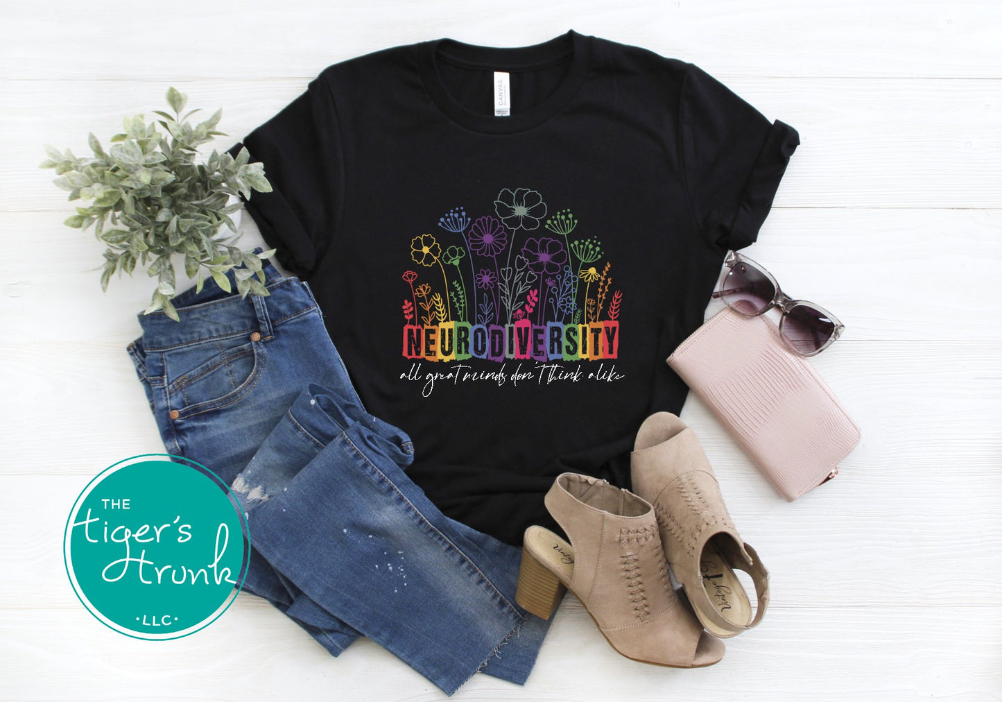 T-shirt with floral elements and the quote "All Great Minds Don’t Think Alike," gift-ready design for neurodivergent pride and mental health support