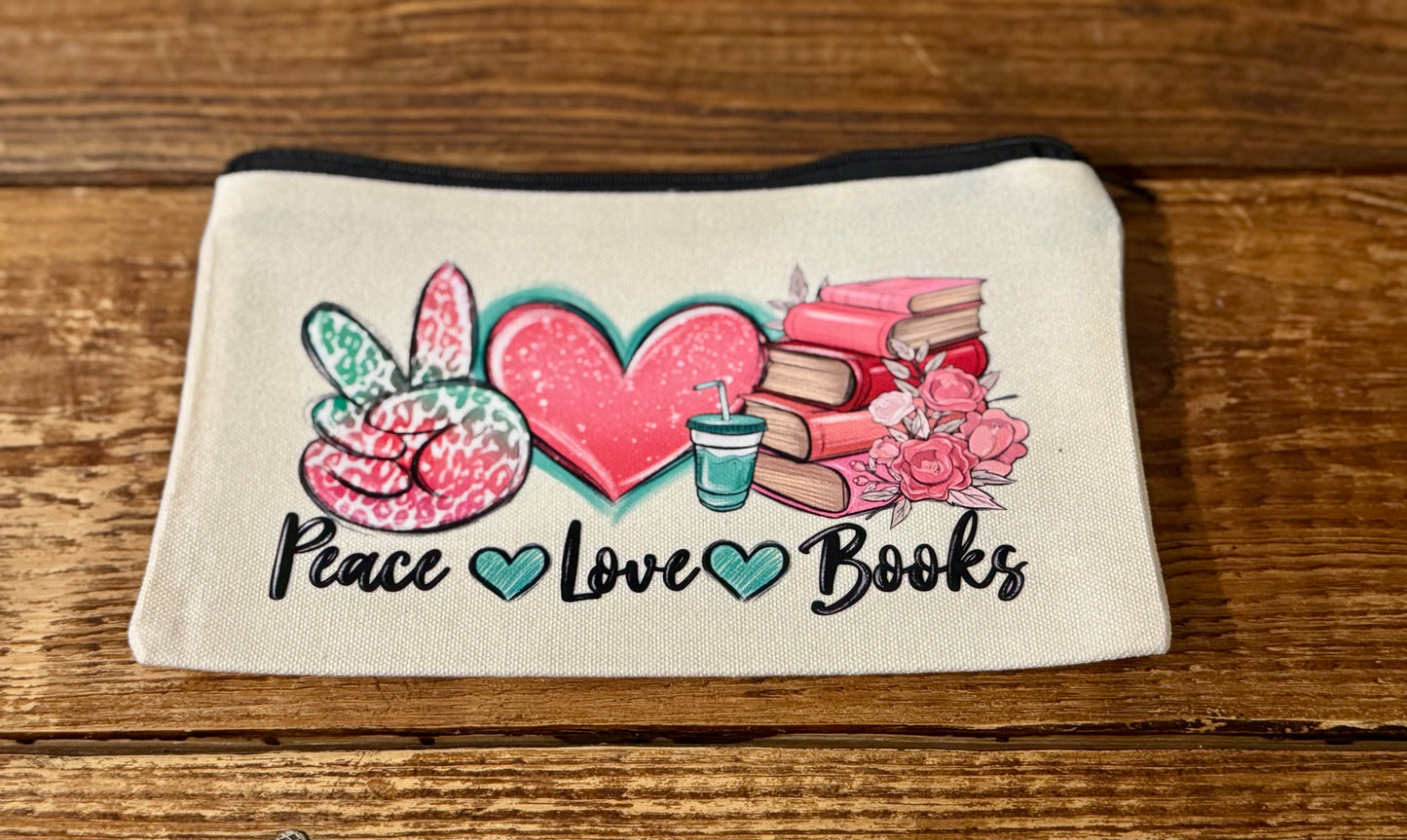 5"x8" zippered carry-all bag featuring the phrase Peace Love Books with a stylish design, perfect for book lovers to store essentials and reading accessories.