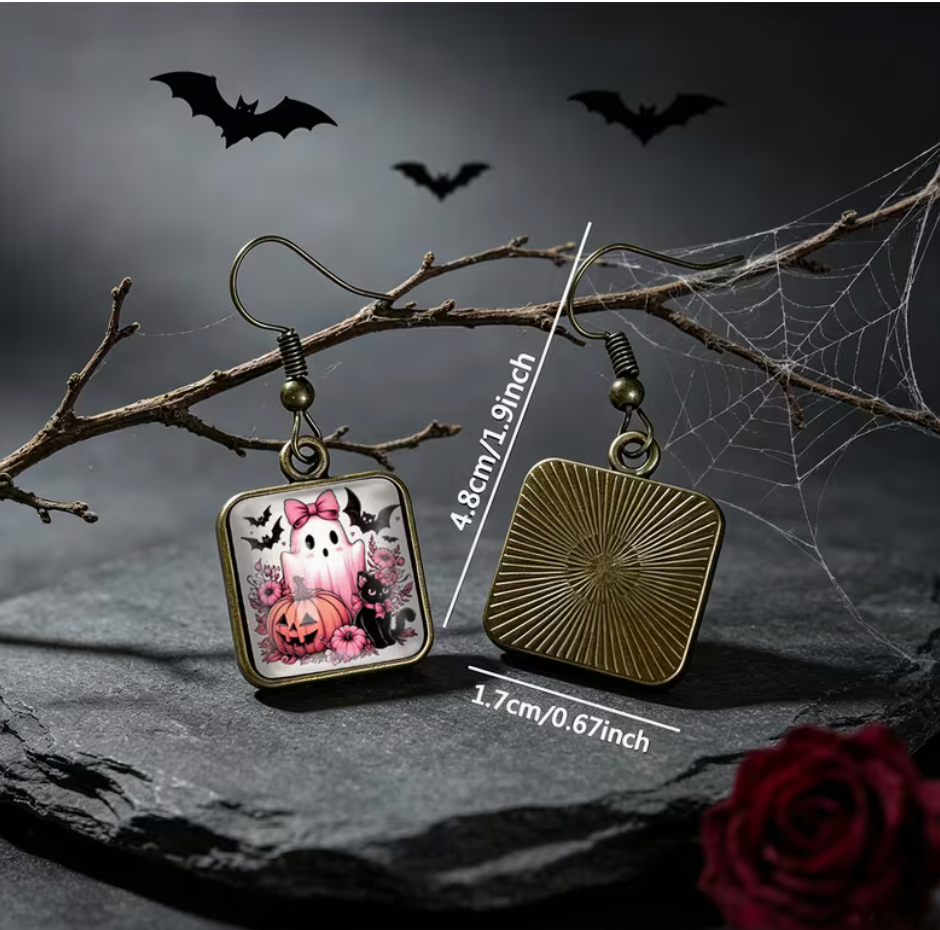 Front and back of pink ghost Halloween earrings showing 1.9 inch length and 0.67 inch square pendant