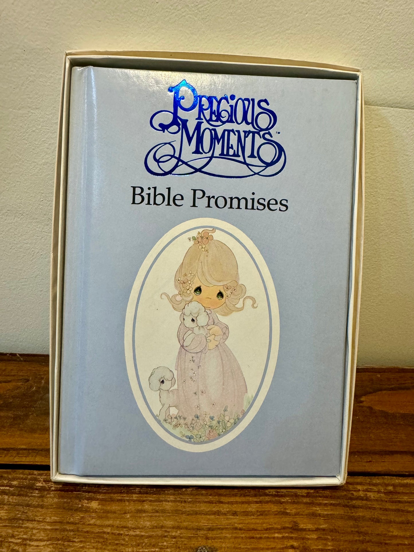 Cover of the 1990 Precious Moments Vintage Bible, featuring a pastel design with classic Precious Moments illustrations.