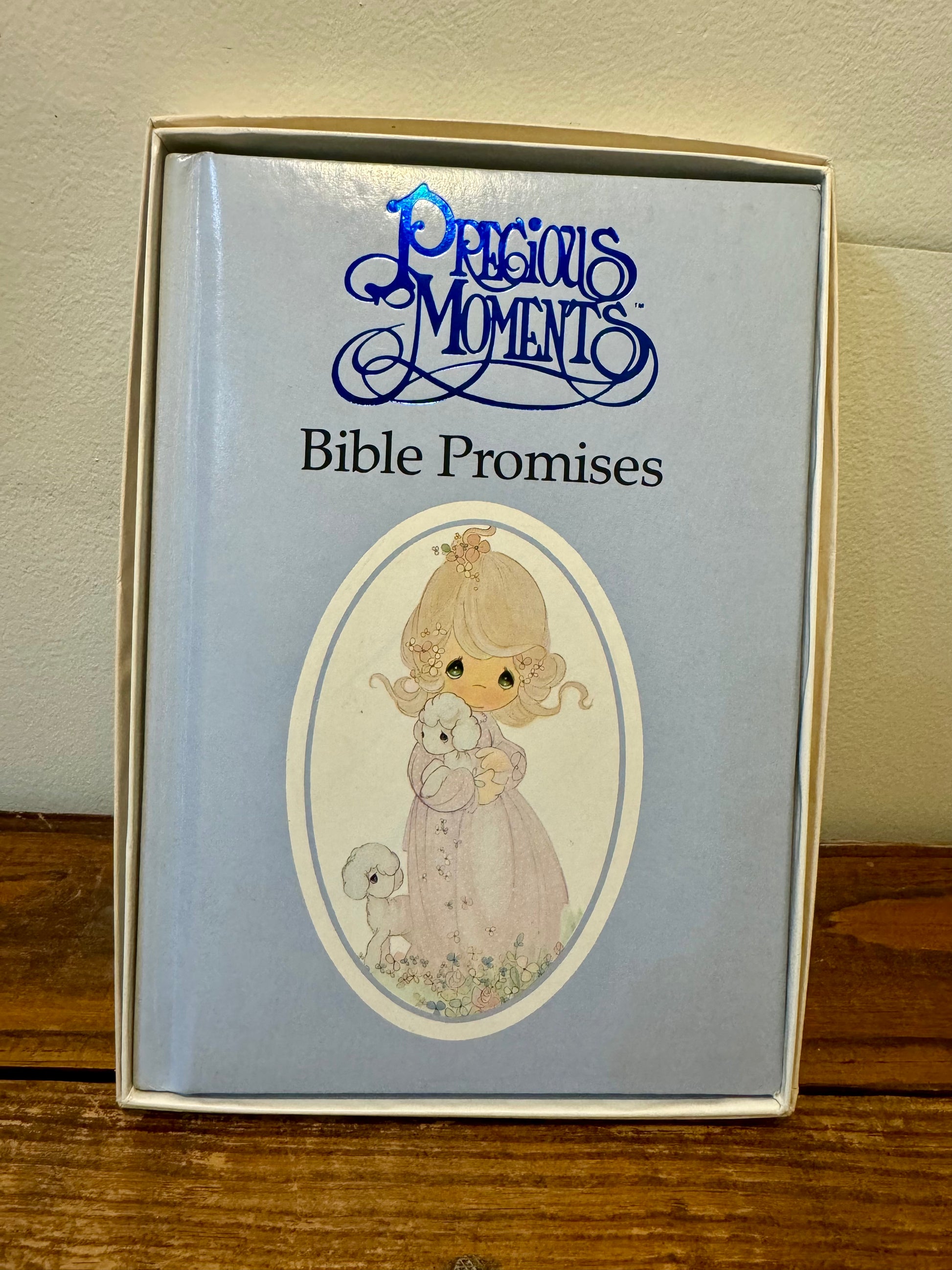 Cover of the 1990 Precious Moments Vintage Bible, featuring a pastel design with classic Precious Moments illustrations.
