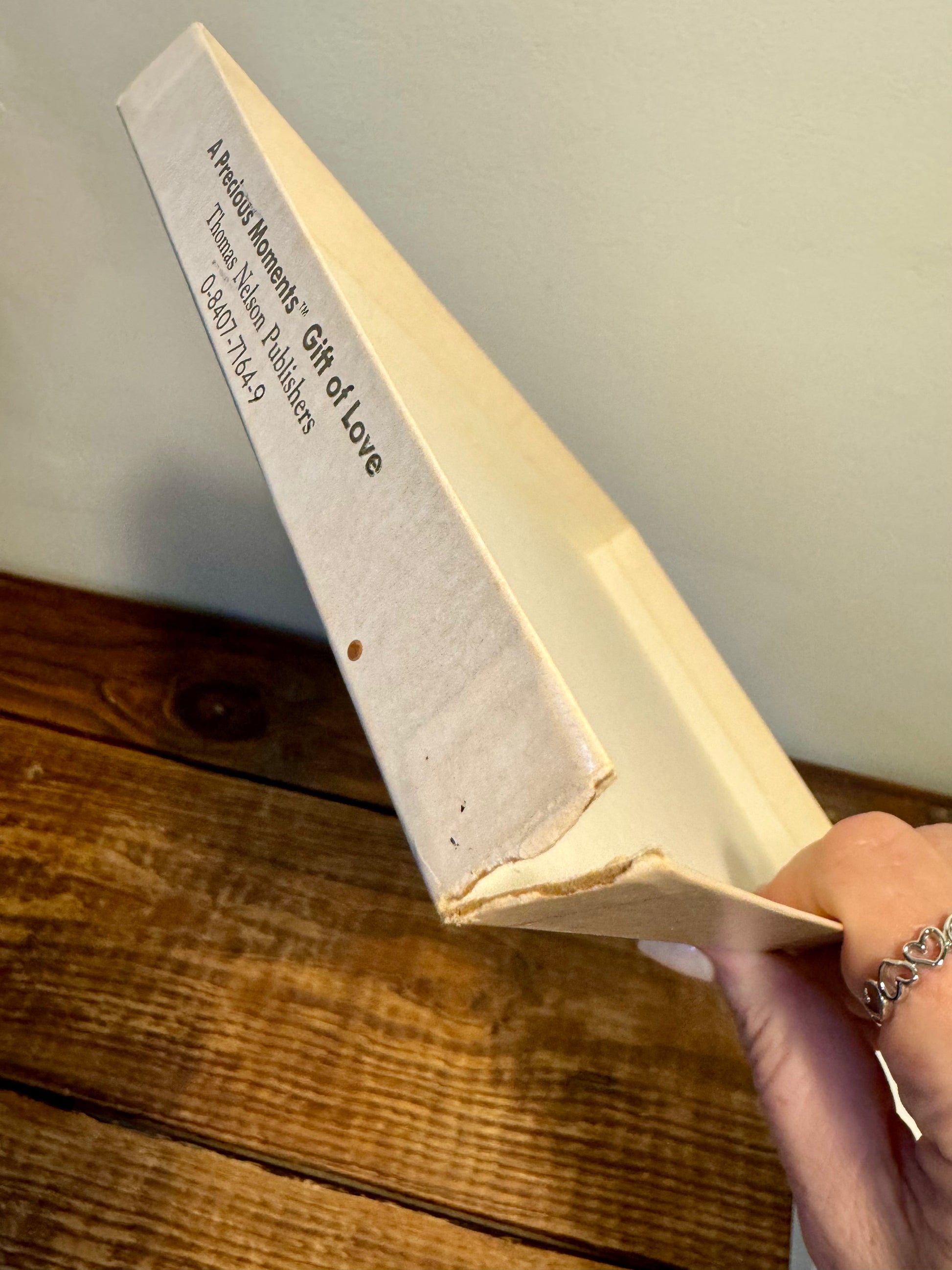 Cover of the 1988 Precious Moments Vintage Christmas Book, featuring classic Precious Moments holiday illustrations