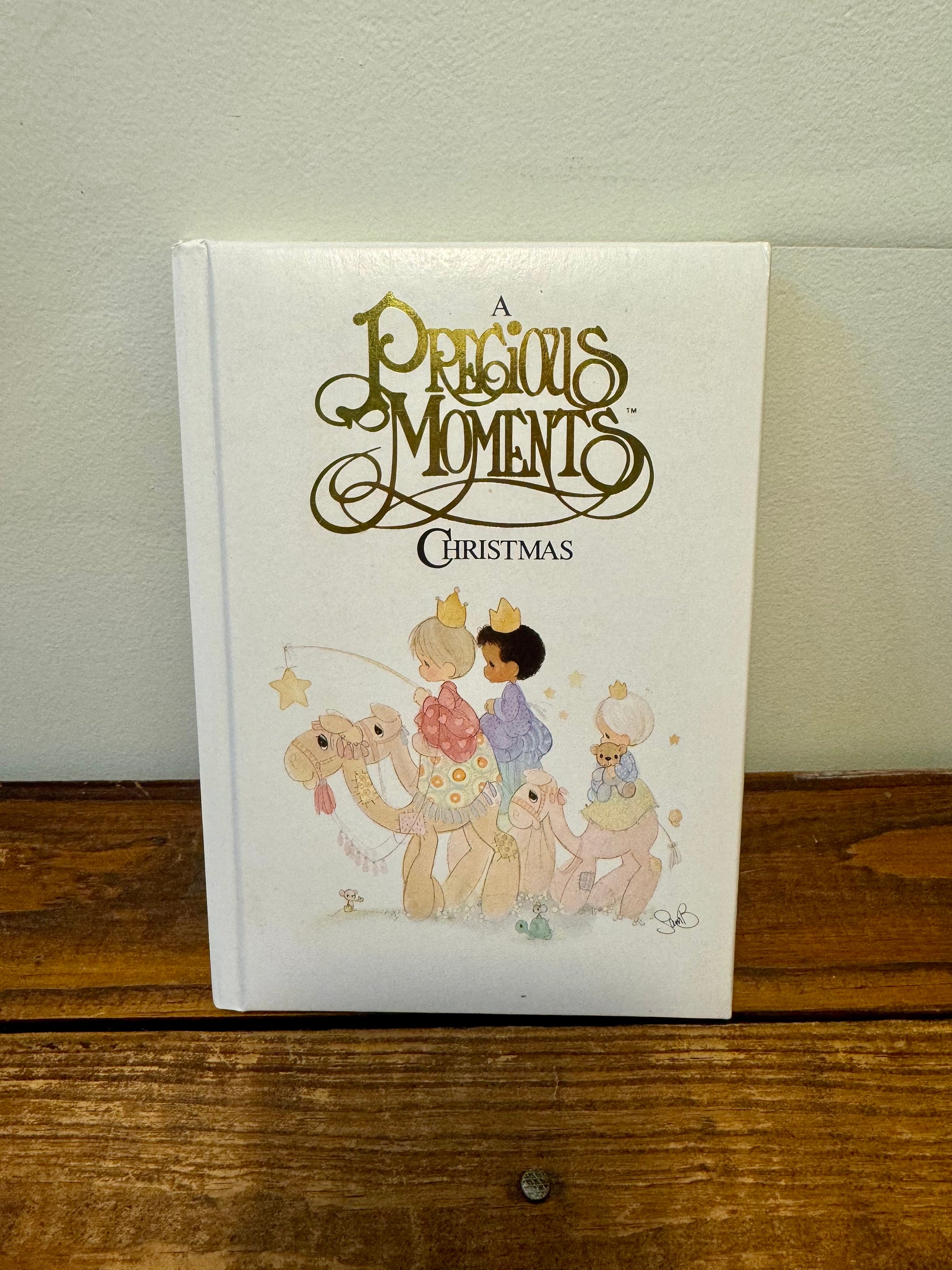 Cover of the 1988 Precious Moments Vintage Christmas Book, featuring classic Precious Moments holiday illustrations.