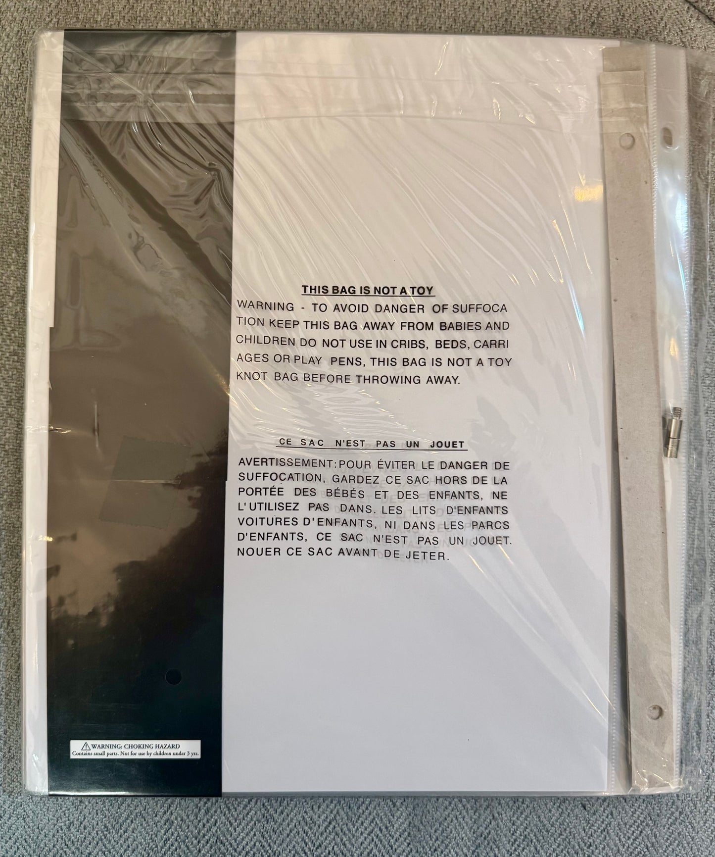 8.5x11 scrapbook album refill pages by The Paper Studio with post bound and 3 ring punched page protectors and white paper inserts in clear packaging on a neutral flat lay background