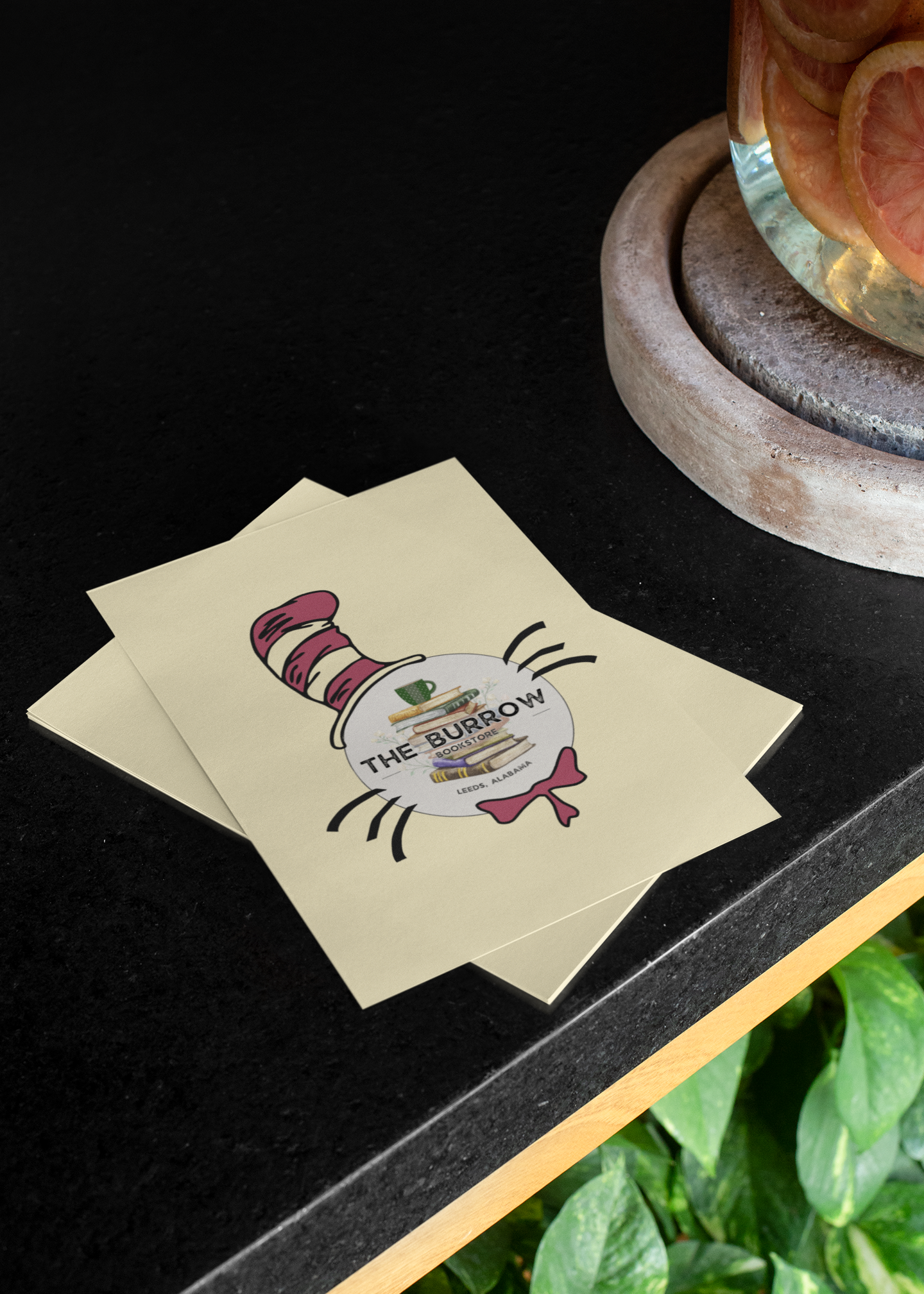 A playful 4" x 5.5" postcard featuring a Dr. Seuss-inspired design with The Burrow Bookstore branding, perfect for book lovers and collectors.