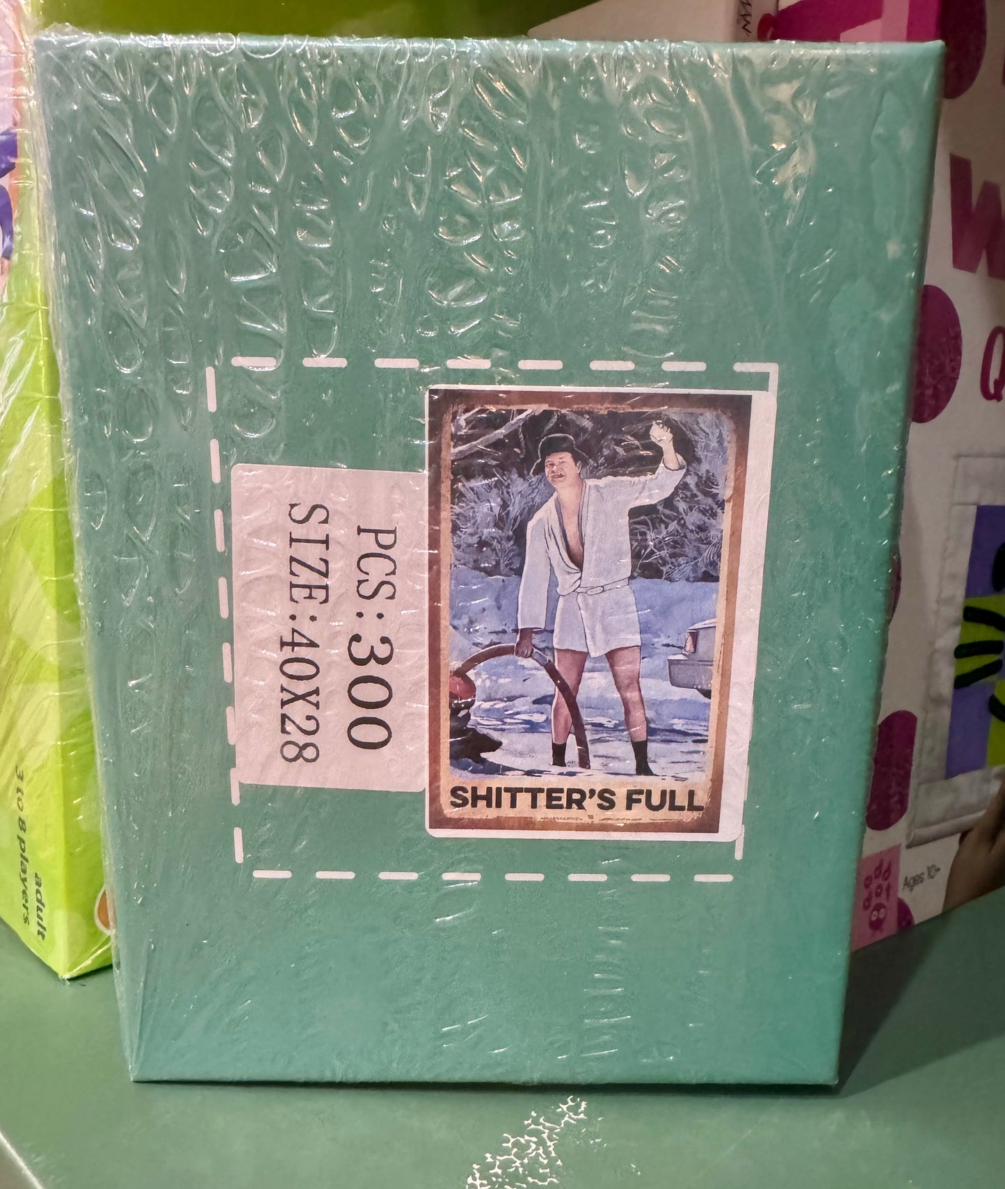 300-piece puzzle featuring a holiday RV scene and the phrase Shitter’s Full—a humorous reference for fans of Christmas Vacation.