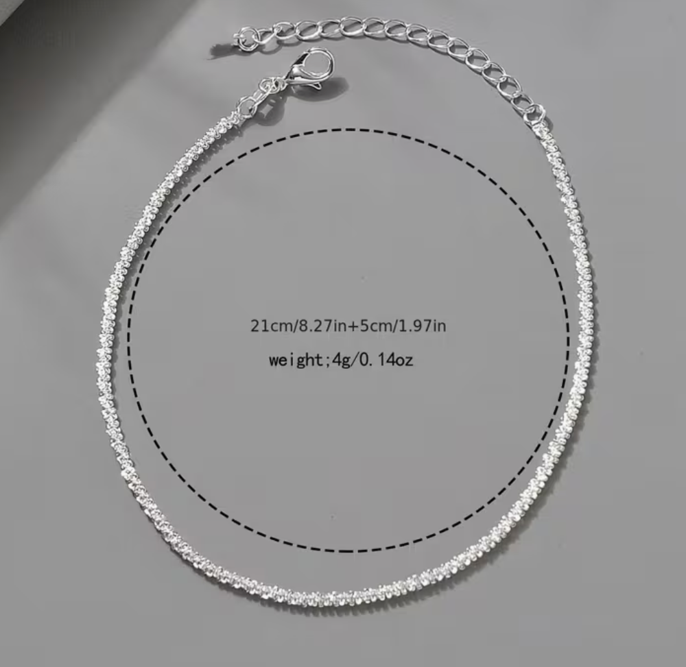 Silver rhinestone anklet with adjustable chain and lobster clasp shown flat with measurement details