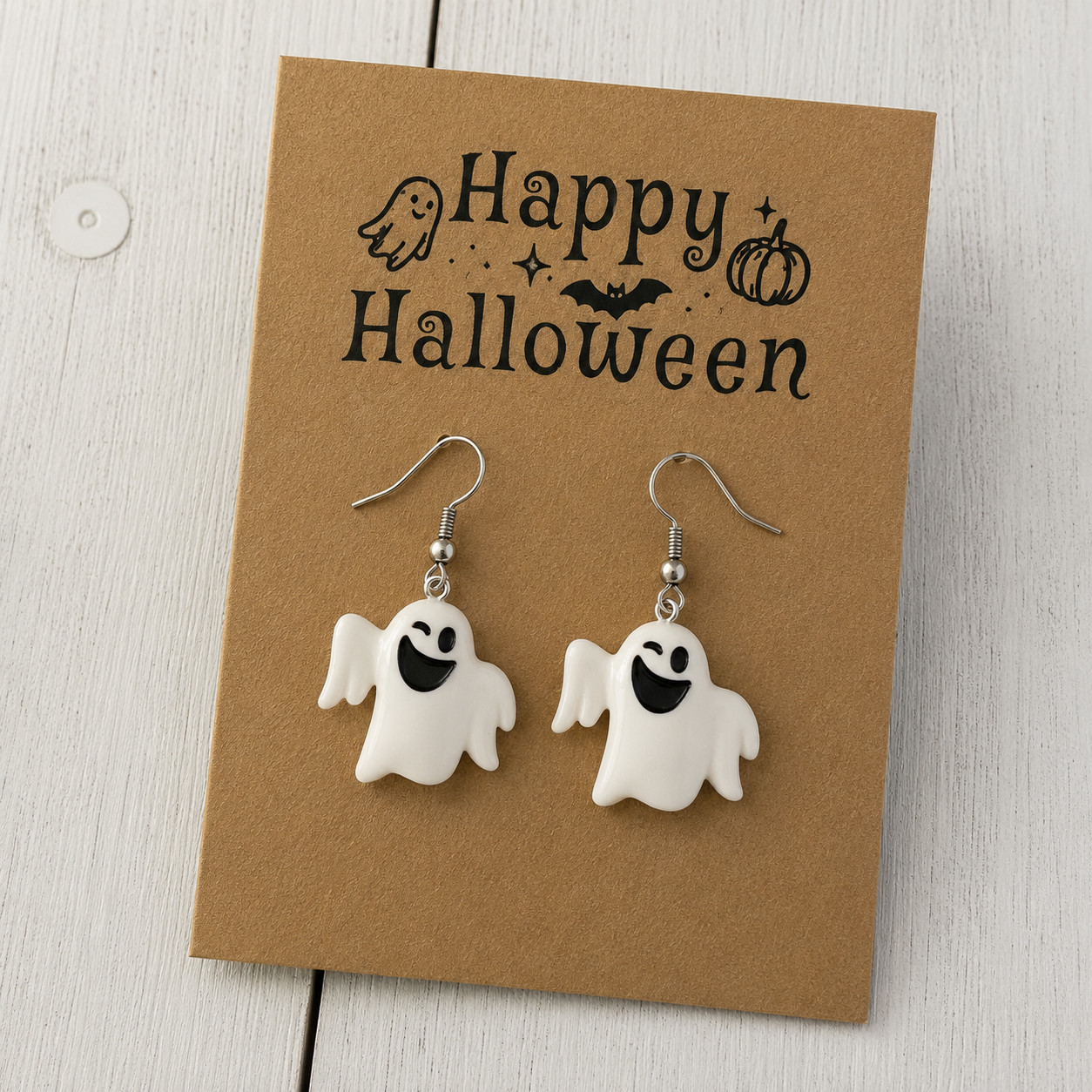 Cute smiling white ghost resin dangle earrings with silver-tone hooks for Halloween