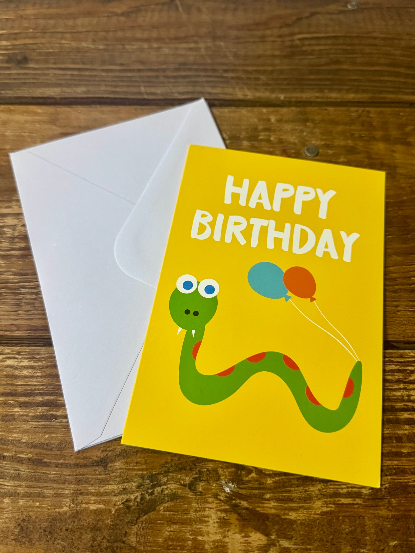 A playful set of two snake-themed birthday cards for kids, featuring adorable and fun snake illustrations.