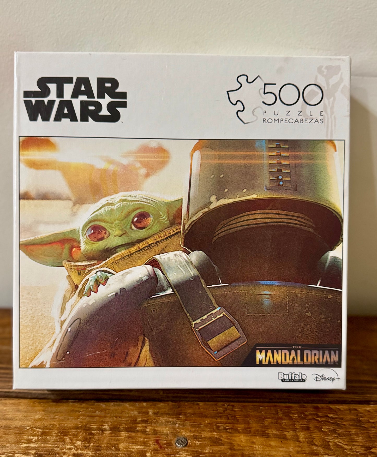 A 500-piece Star Wars: The Mandalorian puzzle featuring Mando and Grogu in an action-packed scene. Perfect for Star Wars fans and puzzle lovers.