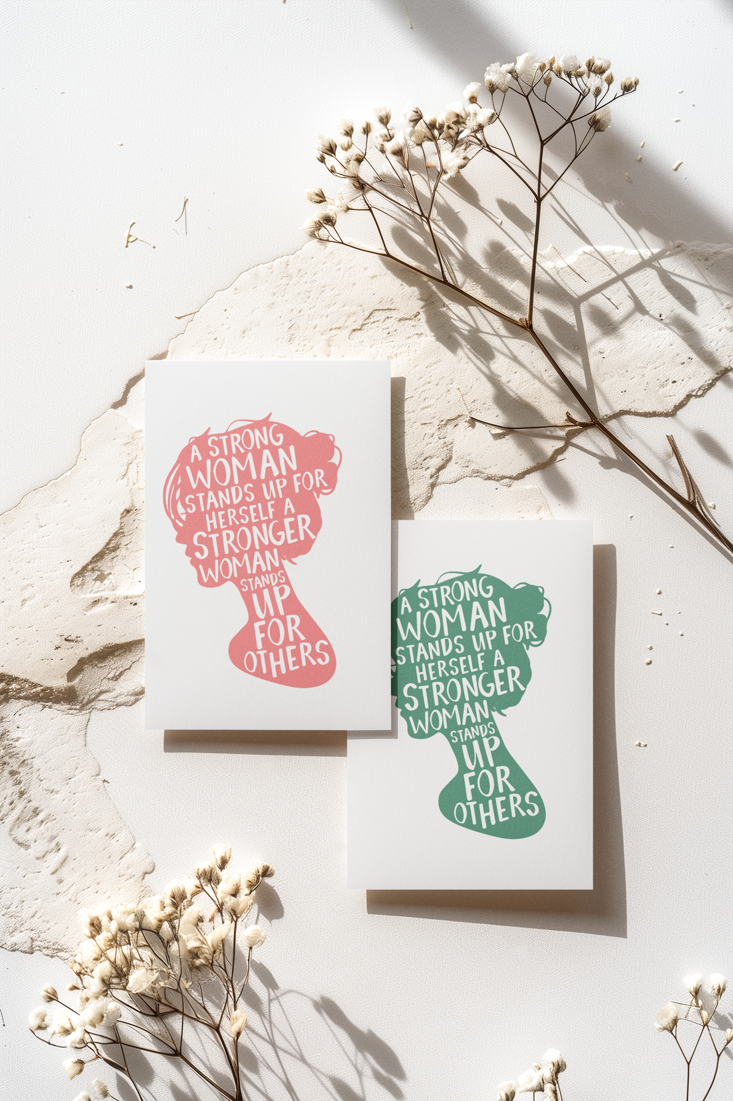 A Women’s History Month postcard featuring the silhouette of a woman’s head and the empowering quote: A strong woman stands up for herself. A stronger woman stands up for others.