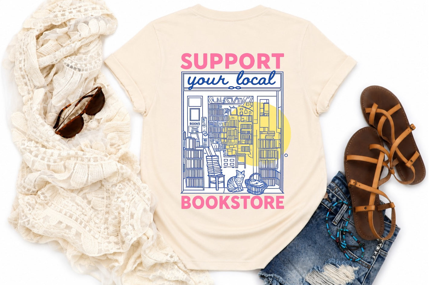 Back of natural bookstore T-shirt featuring Support Your Local Bookstore artwork.