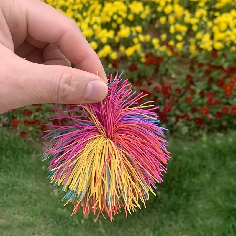 Set of rainbow-colored soft and stretchy sensory play balls, ideal for stress relief, party favors, or holiday gifts for all ages.