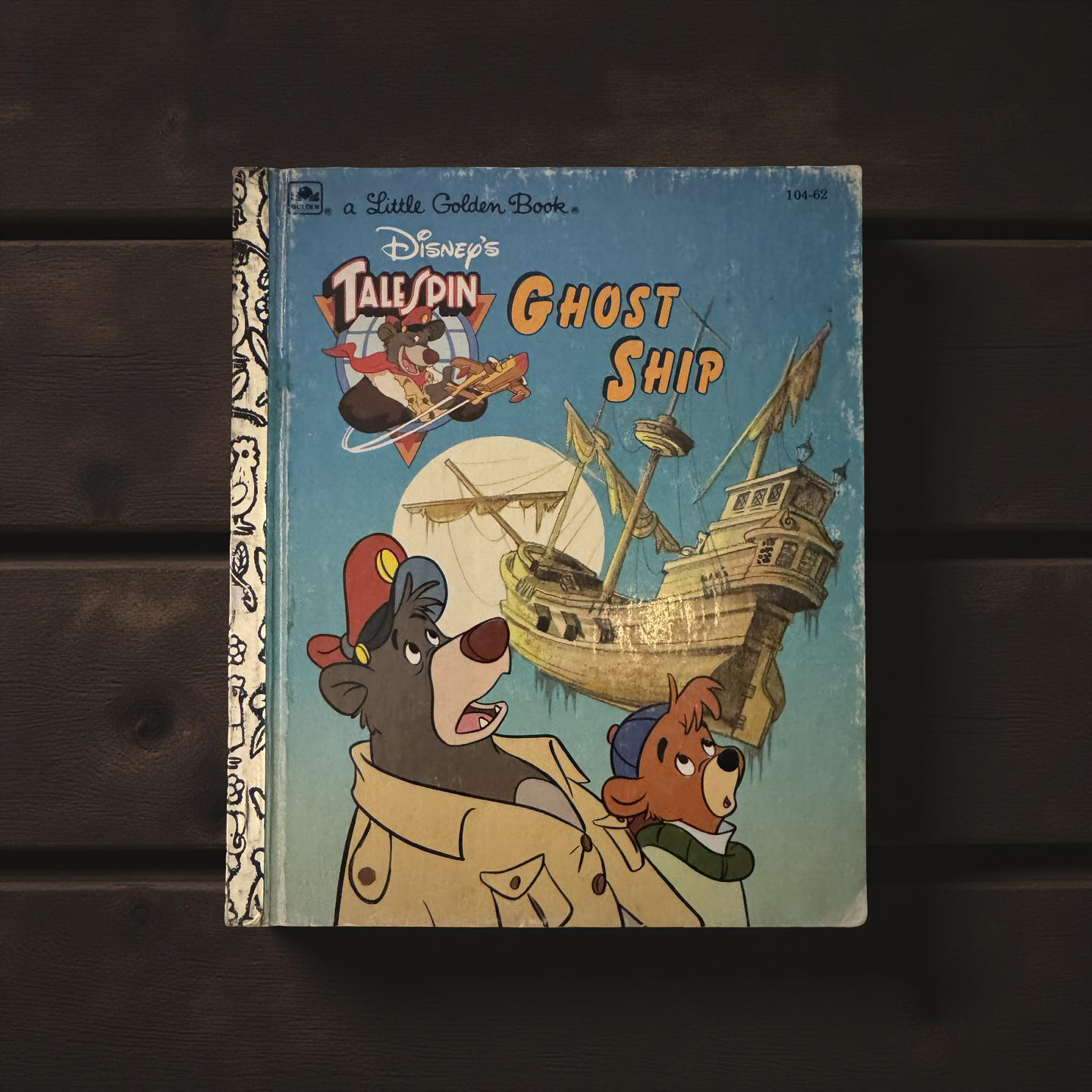Front cover of TaleSpin Ghost Ship Little Golden Book by Justine Korman featuring Baloo, Kit, and an eerie ship in the sky