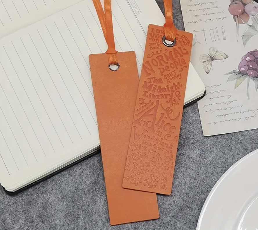 Soft and durable faux leather bookmark in a bright, colorful design—perfect for marking pages in your favorite book.