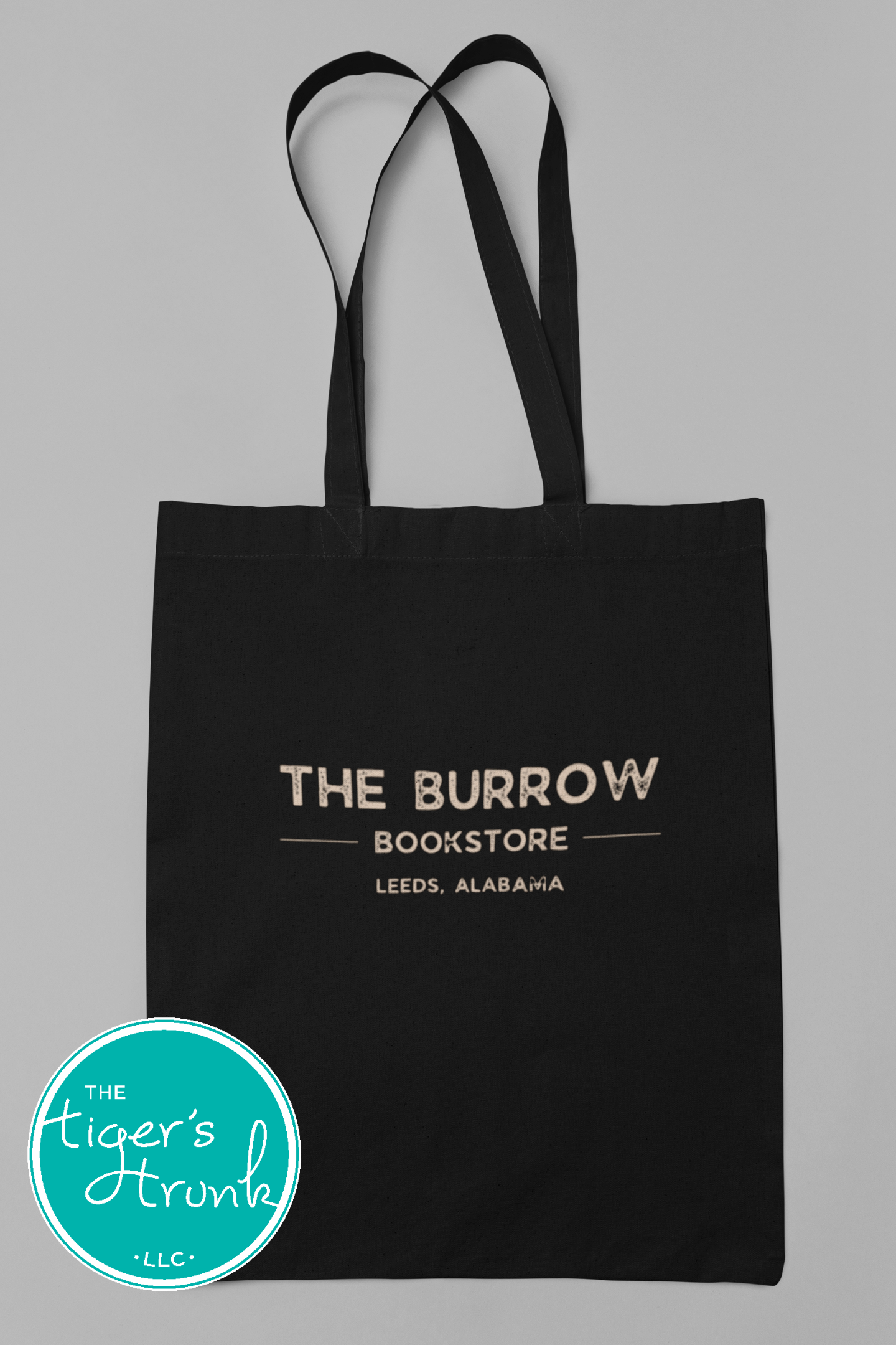 Canvas tote bags featuring The Burrow Bookstore logo on one side and various literary quotes on the other side.