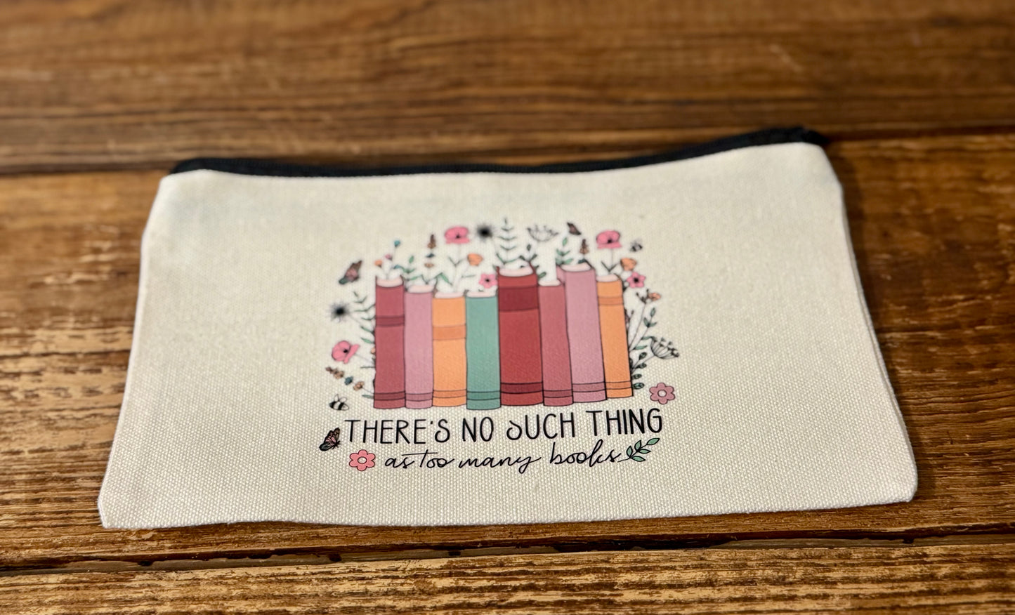 5"x8" zippered carry-all bag featuring the phrase There's No Such Thing as Too Many Books, perfect for book lovers to store essentials, accessories, or small treasures.