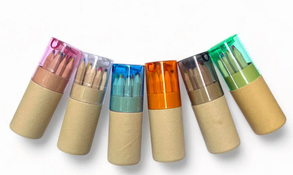 Set of colorful wooden pencils in cardboard casings on a white background