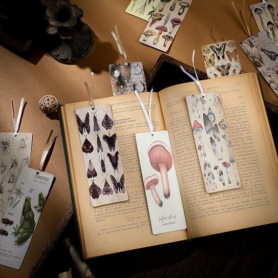 A variety of colorful bookmarks in assorted designs, laid out on a table, perfect for book lovers.
