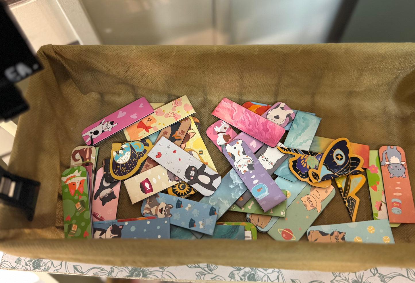 A colorful assortment of magnetic bookmarks in various designs, perfect for keeping your place in books or planners.