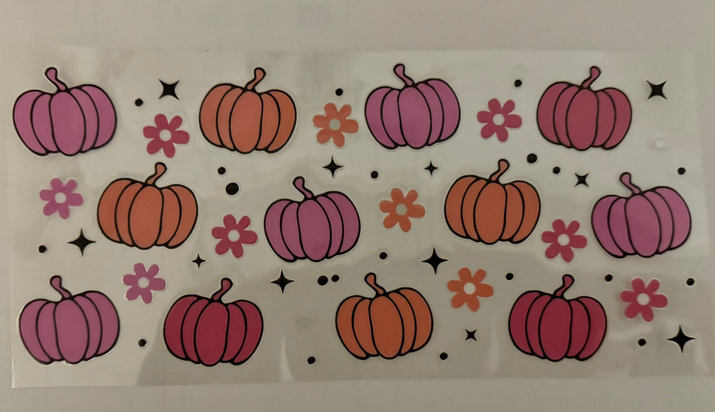Pattern of pumpkins and flowers on a white background