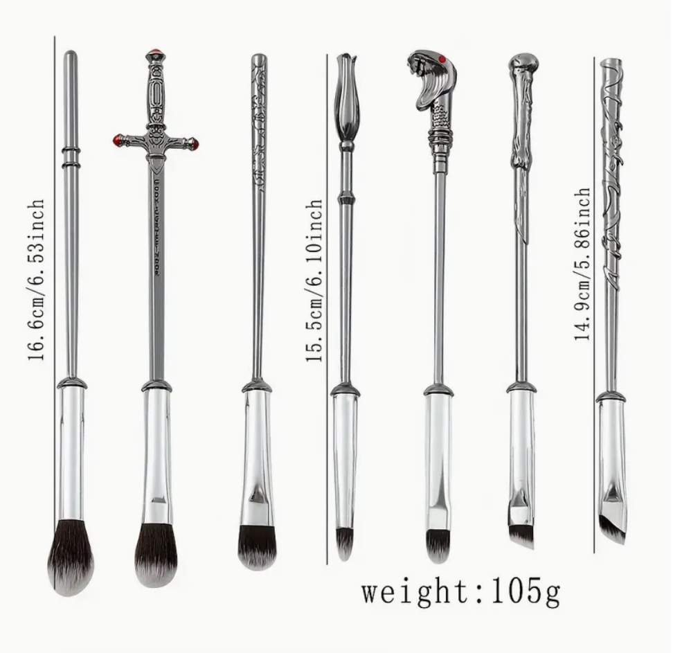 Set of makeup brushes with handles designed to resemble wizard wands, featuring intricate detailing and soft bristles.