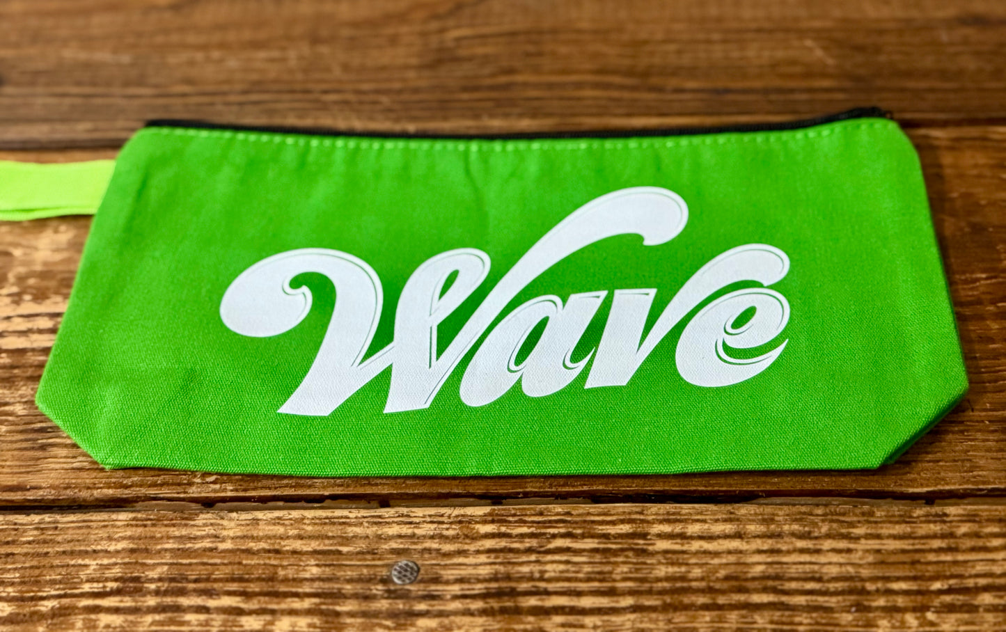 Accessories makeup pouch featuring the word Wave, representing the local school mascot, the Greenwave.