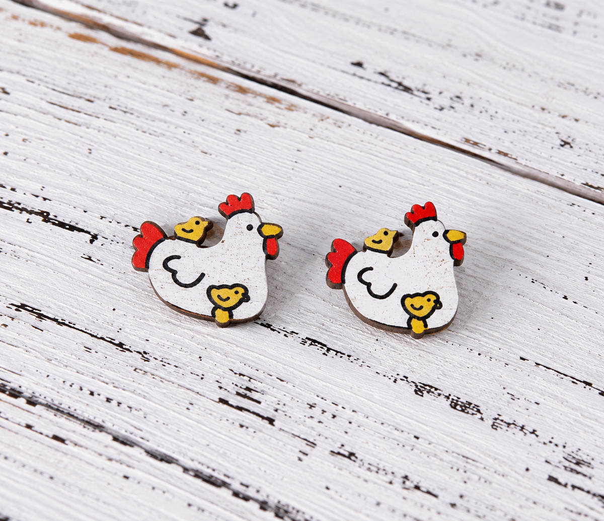 Pair of rustic white chicken stud earrings featuring yellow baby chicks