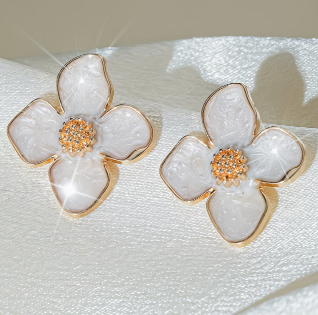 White flower stud earrings with glossy oil drip finish and gold tone outline