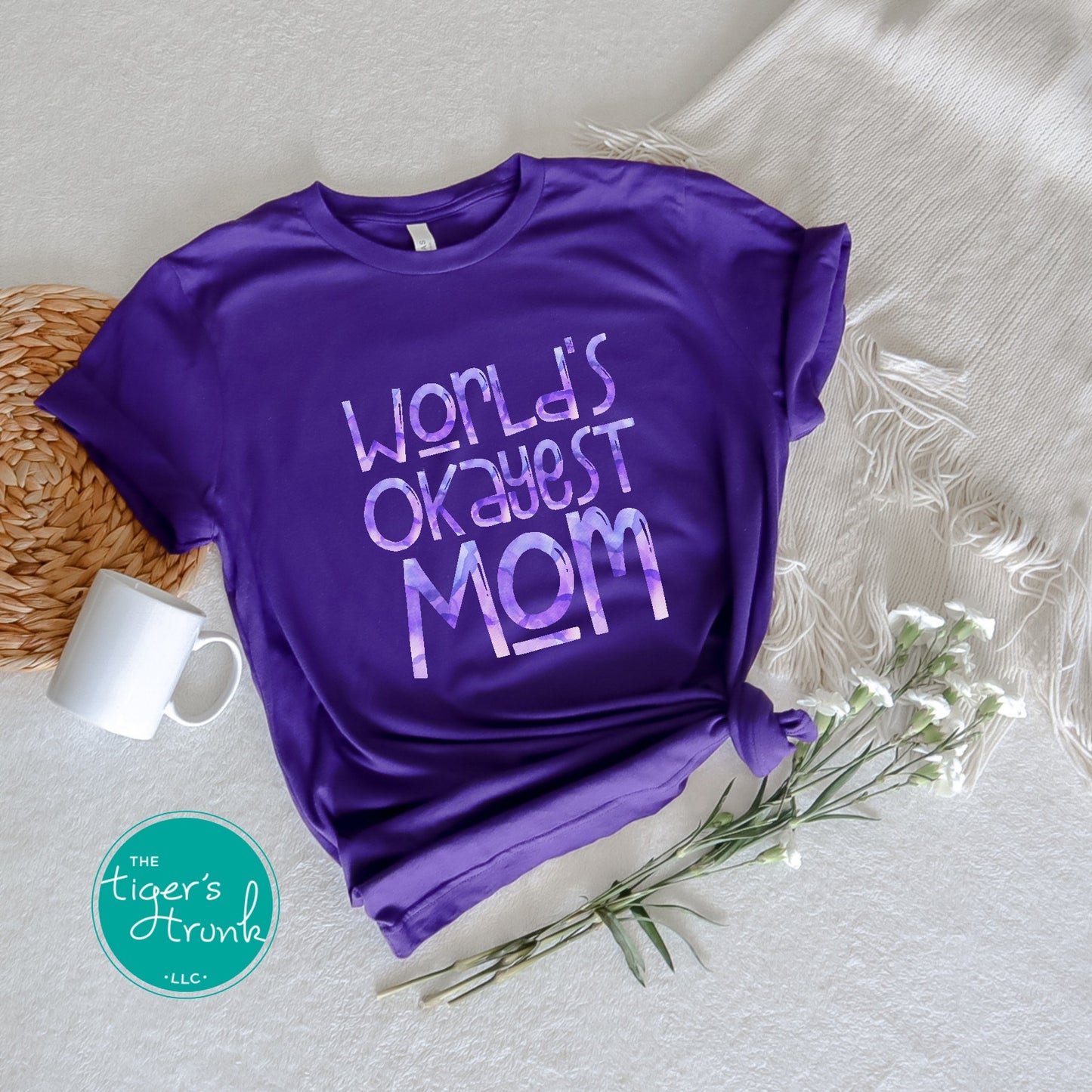 Funny graphic t-shirt with "World’s Okayest Mom" phrase, casual and relatable gift idea for Mother’s Day or everyday mom life