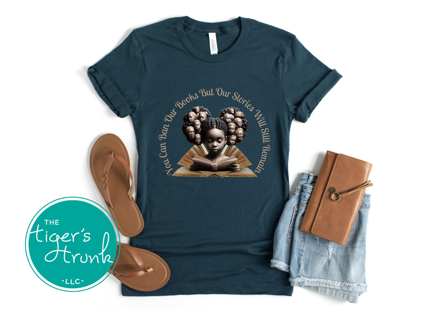 Teal t-shirt with graphic design and accessories on a white background