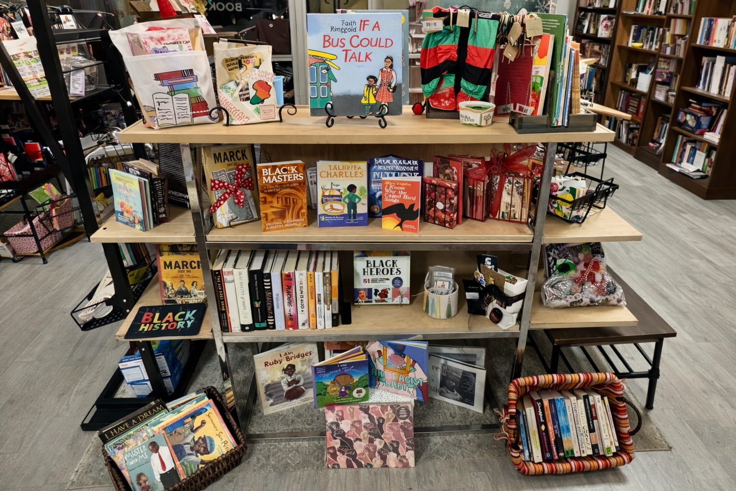 A thoughtful bookstore display featuring Black history nonfiction books, arranged with warm lighting, framed historical imagery, and subtle celebratory décor.