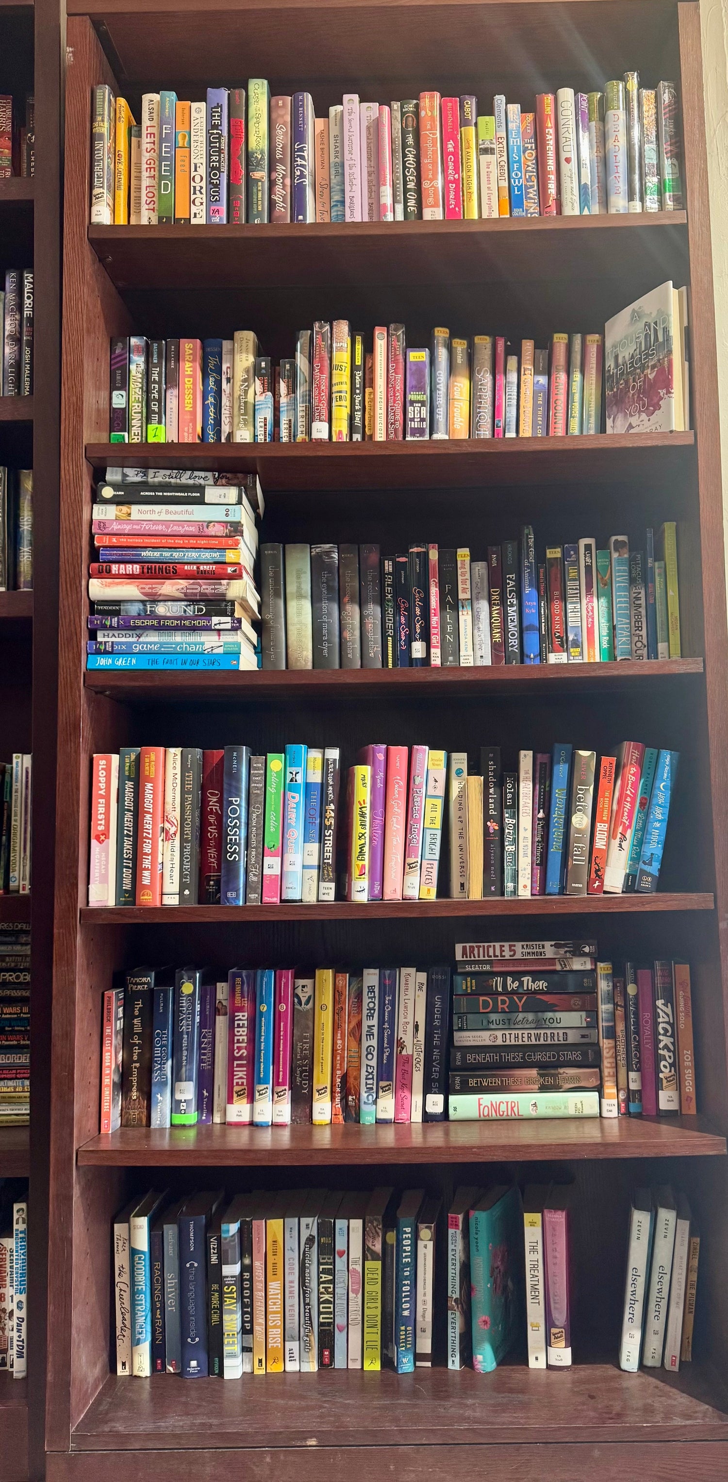A bright bookstore display featuring YA nonfiction books arranged with teen-friendly décor like notebooks, colorful accents, and a small sign that reads “YA Non-Fiction.”