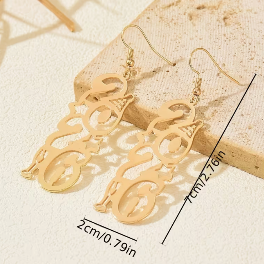 Gold 2026 New Year dangle earrings displayed flat with measurements shown